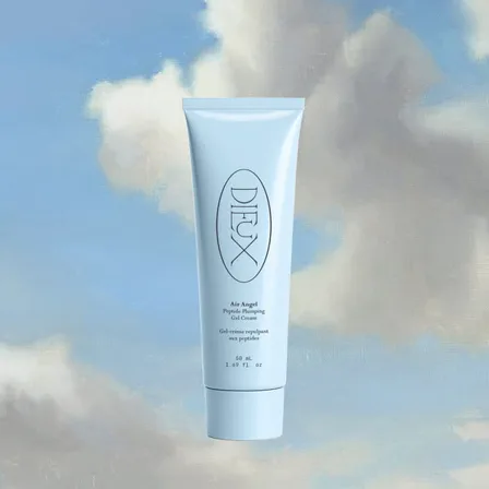 A Dieux ad creative: a pale blue Air Angel tube floating against a painted blue sky with clouds