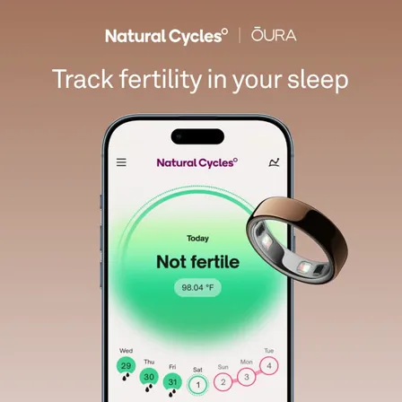 An Oura and Natural Cycles ad creative: the line "Track fertility in your sleep" above a phone showing a not fertile reading beside the ring