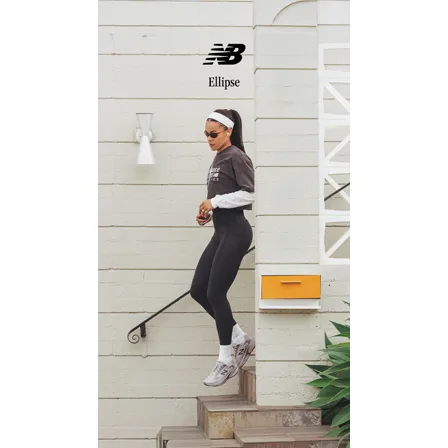 A New Balance ad in the Pinterest Ads Repository: a runner in black leggings and a grey sweatshirt stepping down a white stairway in Ellipse trainers