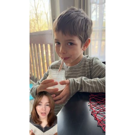 A UGC ad showing a child drinking with a creator reaction inset in the corner
