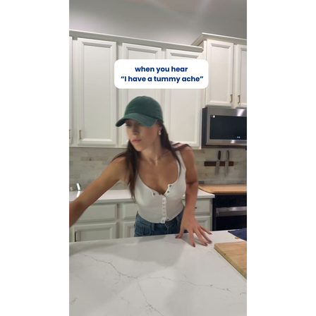 A UGC ad opening on a kitchen scene captioned "when you hear I have a tummy ache"