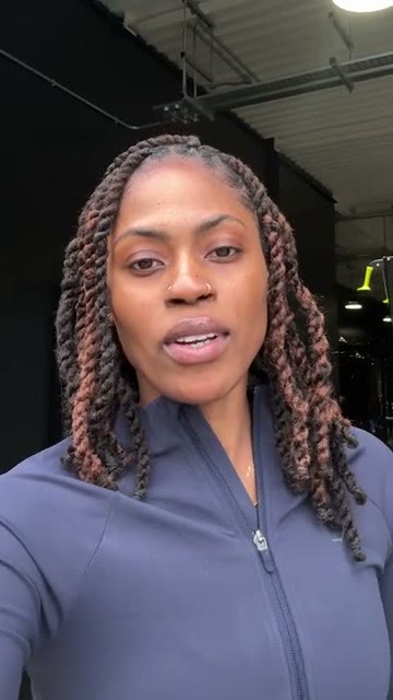 A TikTok ad by Gymshark in the TikTok Ads Library: a woman in a navy zip top talking to camera in a gym