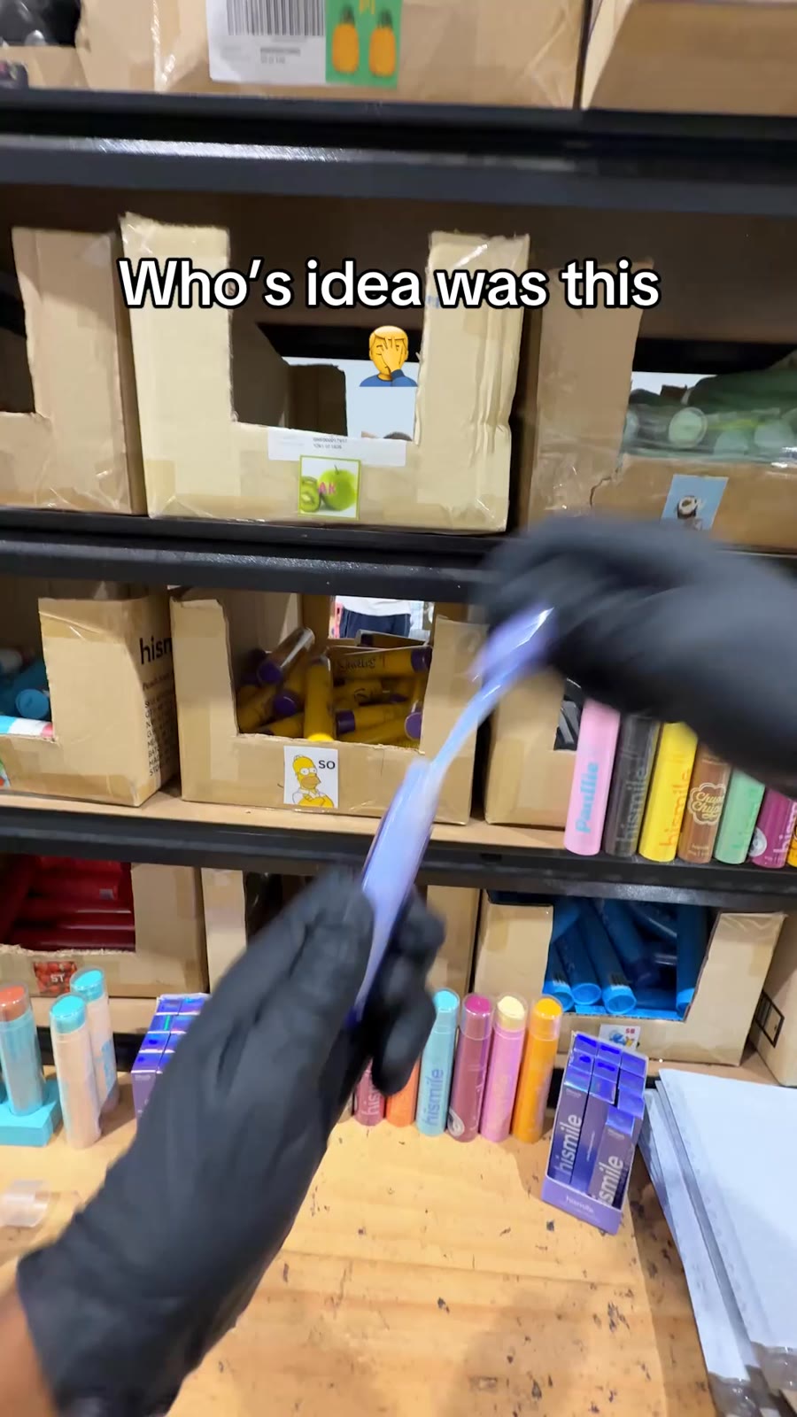 An ad by Hismile in the Meta Ad Library: a video still of a hand in a black glove over warehouse shelves, captioned Who’s idea was this