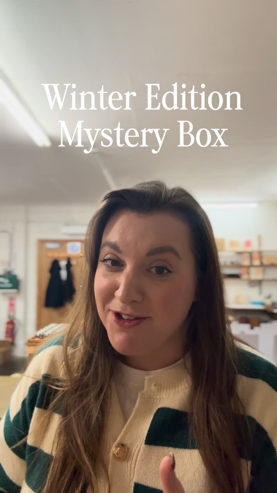 An ad by Pintail Candles in the Meta Ad Library: a video still of a woman holding a box, captioned Winter Edition Mystery Box