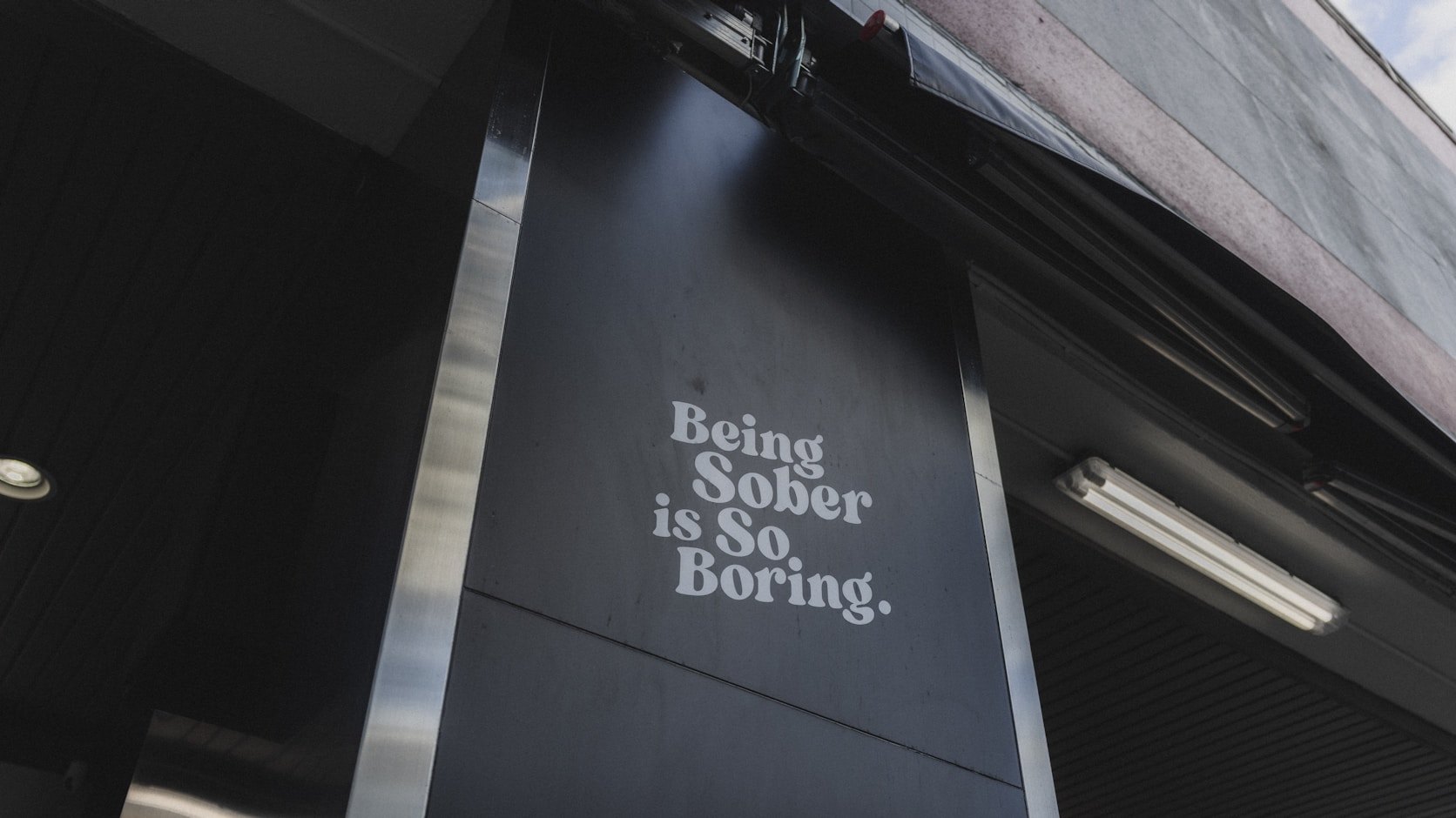 Being Sober is So Boring. set in a shopfront window: a voice decision on a surface nobody planned for