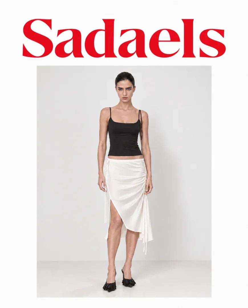 A static ad Selzee made for Sadaels: a model in a black top and a white draped skirt under a red logo