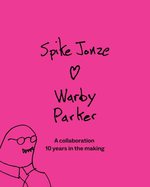 An ad by Warby Parker in Meta's Ad Library: hand-drawn words Spike Jonze heart Warby Parker on hot pink, with a doodle of a man in glasses and A collaboration 10 years in the making