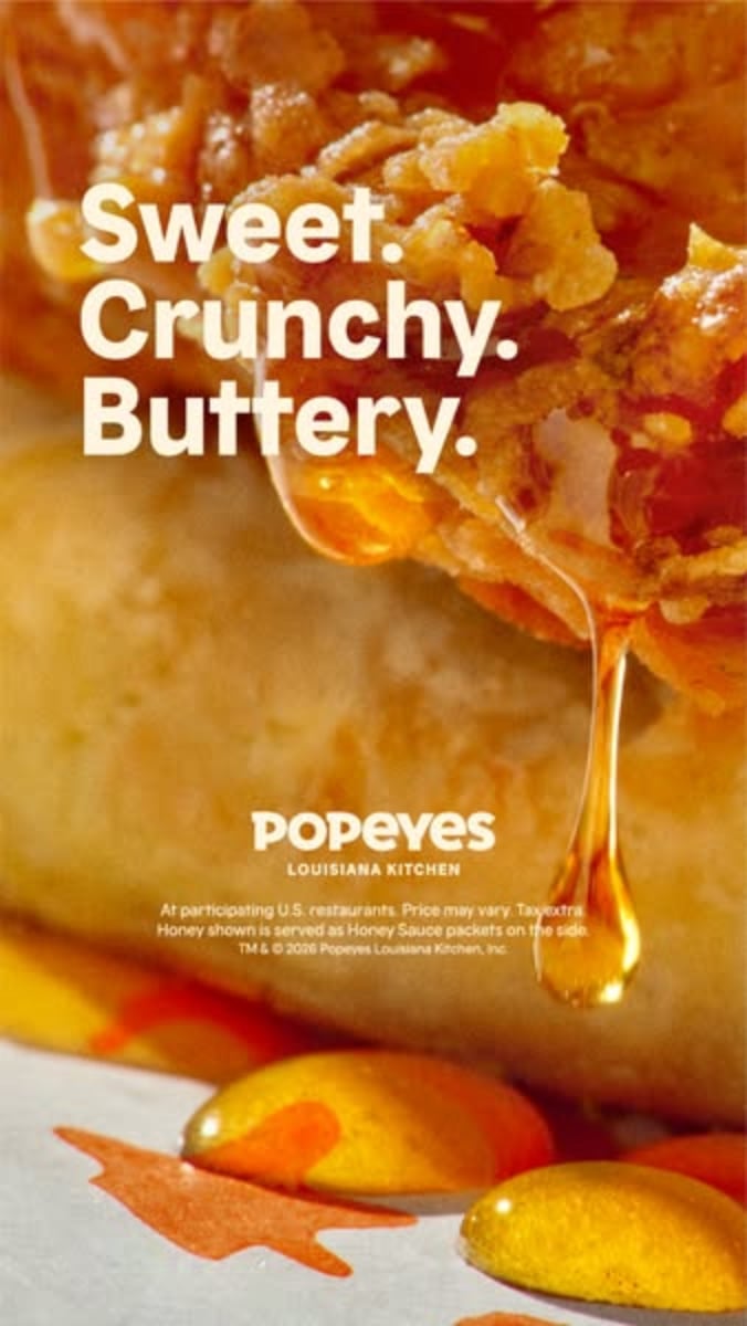 An ad by Popeyes in the Meta Ad Library: honey drips off a crunchy chicken biscuit under the words Sweet. Crunchy. Buttery.