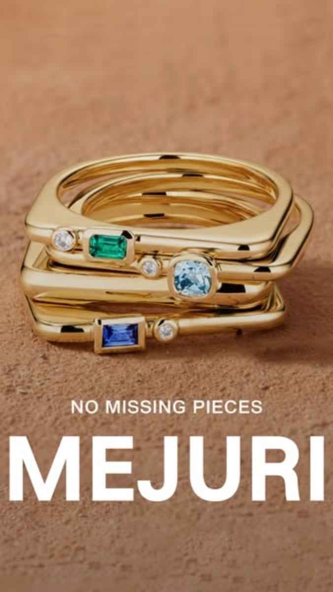 An ad by Mejuri in the Meta Ad Library in 9:16: stacked gold rings with green, blue and white stones over the words No missing pieces