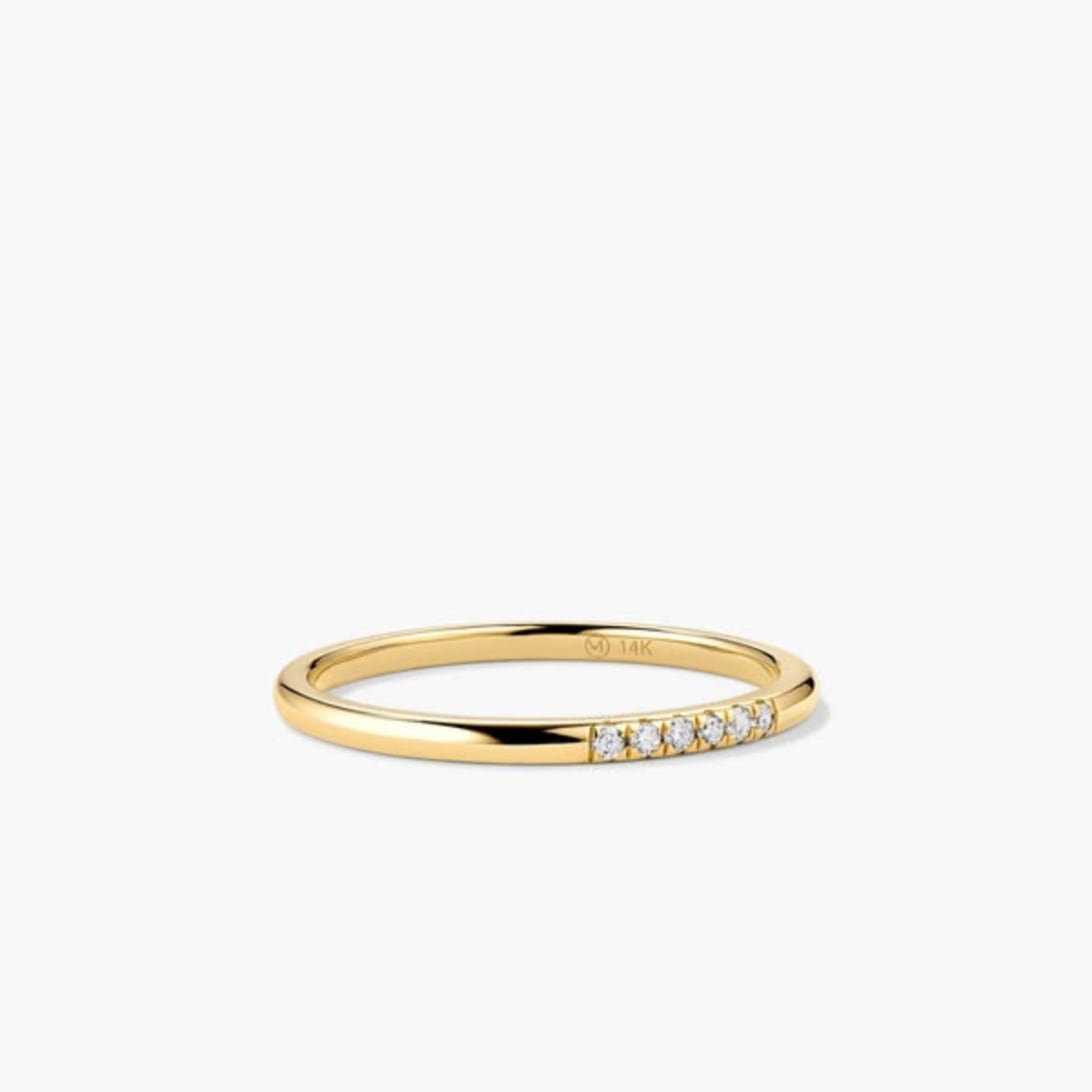 An ad by Mejuri in the Meta Ad Library in 1:1: a single gold ring with a row of small diamonds on a light gray background