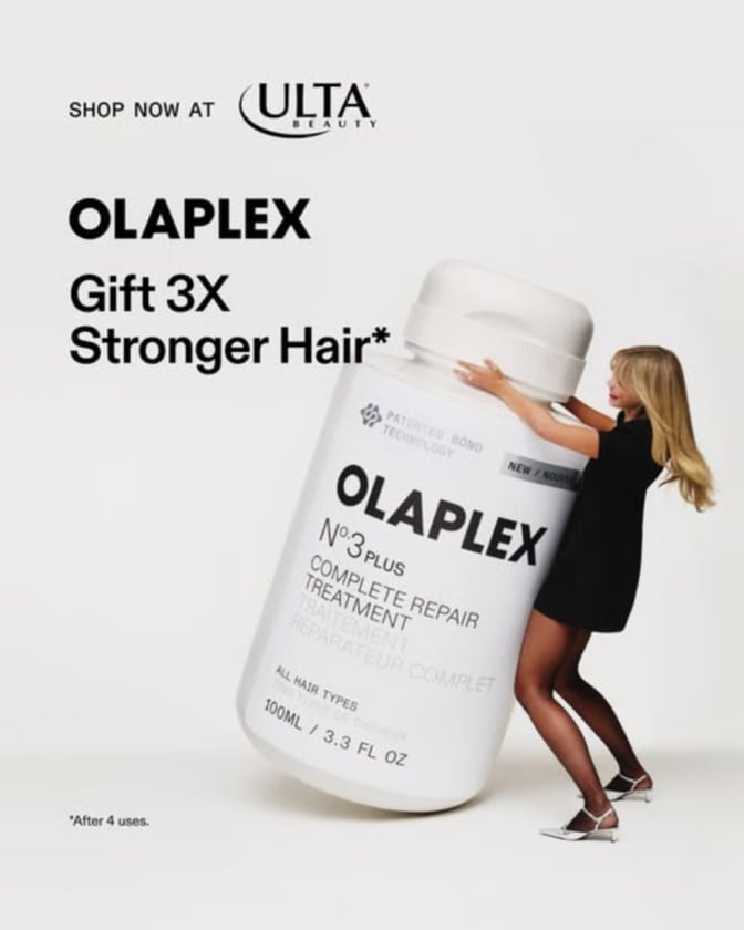 An ad by Olaplex in the Meta Ad Library: Gift 3X stronger hair, with a woman hugging a giant bottle of No.3 treatment