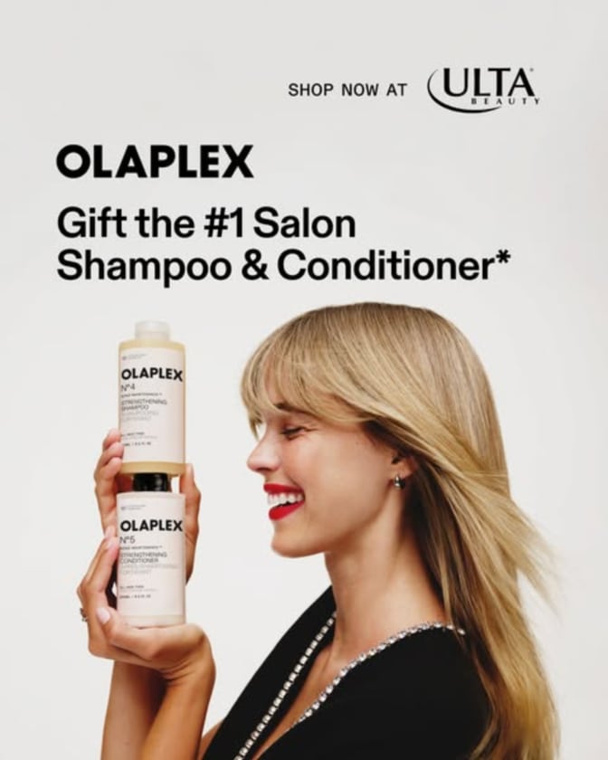 An ad by Olaplex in the Meta Ad Library: Gift the number 1 salon shampoo and conditioner, with a smiling woman holding the No.4 and No.5 bottles