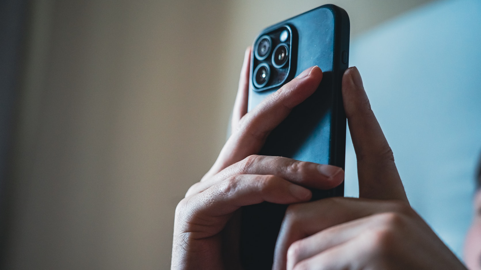 Two hands holding a phone upright, about to record: the whole format, in the only orientation it takes