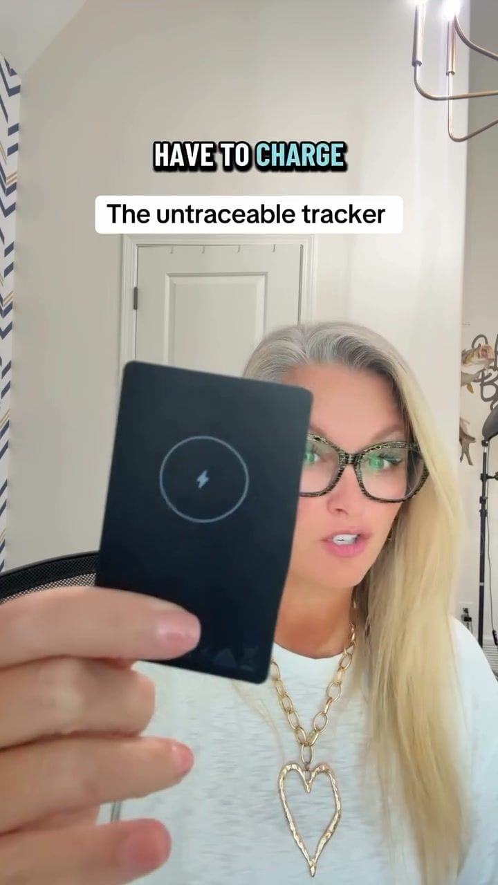 The opening frame of a video ad by The Ridge in Meta's Ad Library: a woman in glasses holds up a black tracker card under the caption The untraceable tracker