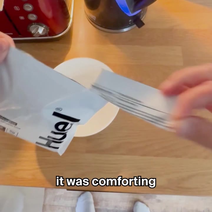 A Huel creator ad on Meta: hands opening a Huel pouch on a kitchen counter, with the caption it was comforting