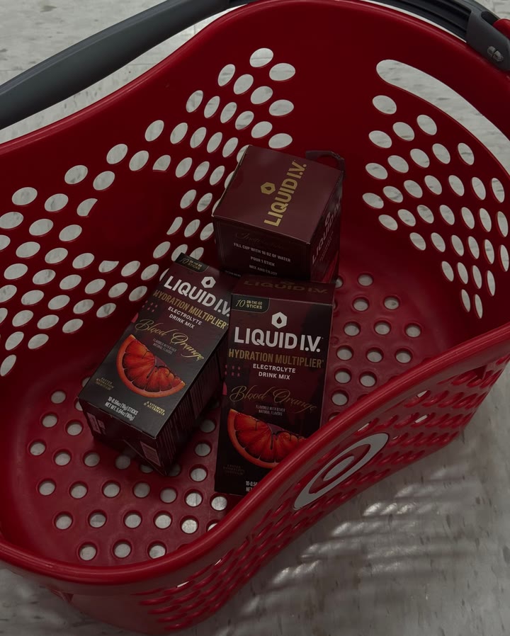 A Liquid I.V. static ad on Meta: a phone photo of Blood Orange boxes in a red Target shopping basket