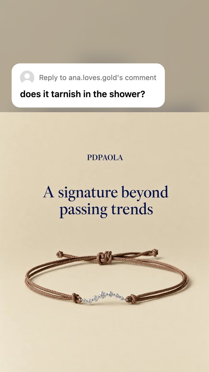 A PDPAOLA bracelet ad as a Reel still with a Reels reply sticker near the top: does it tarnish in the shower?