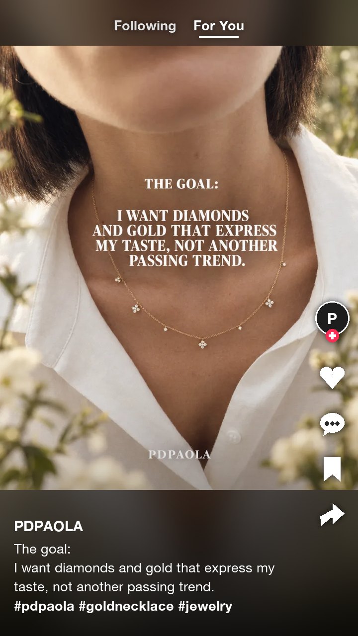 The PDPAOLA gold necklace ad as a TikTok post, with a two line caption and three hashtags