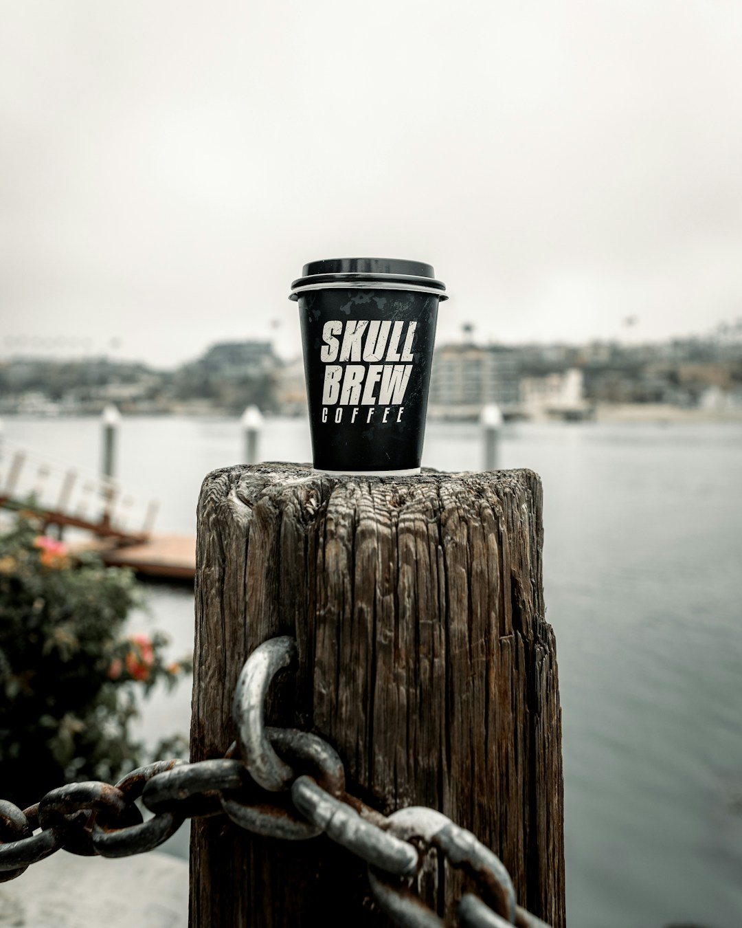 A Facebook post for a coffee brand: a takeaway cup on a harbour post