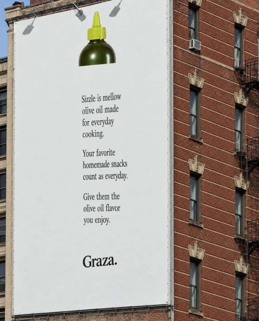 A static ad Selzee made for Graza: a billboard of an olive oil bottle on a brick wall, Sizzle is mellow olive oil made for everyday cooking